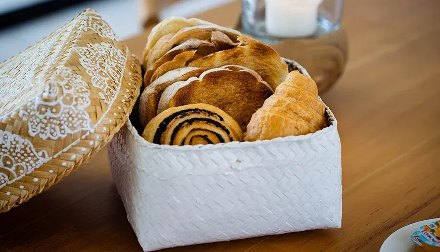 Arita Villa Canggu, Canggu, Bali — delicious assortment of fresh pastries in a decorative basket | The Luxury Bali