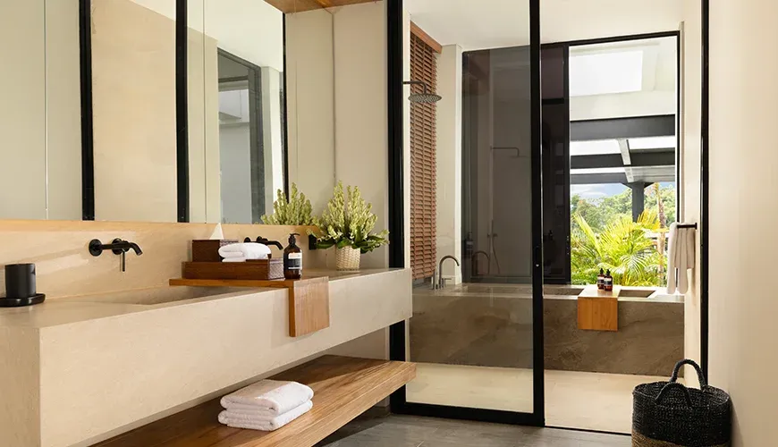 Arita Villa Canggu, Canggu, Bali — elegant bathroom with double sinks and a walk in shower | The Luxury Bali