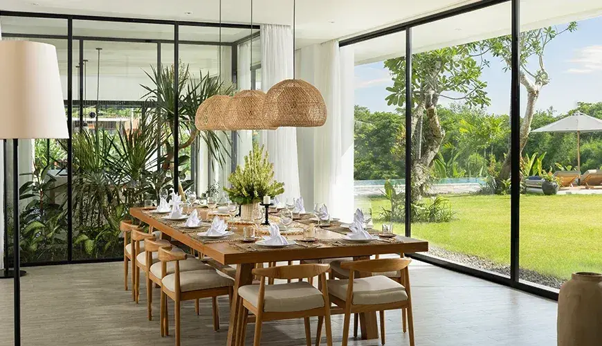 Arita Villa Canggu, Canggu, Bali — elegant dining room with a long table and garden view | The Luxury Bali
