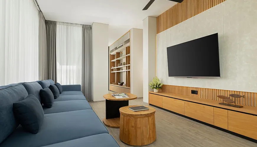 Arita Villa Canggu, Canggu, Bali — elegant entertainment room with a television and bookshelf | The Luxury Bali