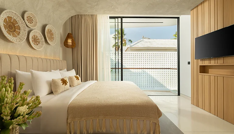 Fenta Villa, Canggu, Bali — bright bedroom with a bed and light wooden accents | The Luxury Bali