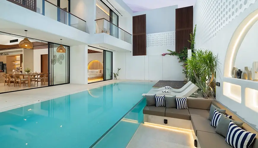 Fenta Villa, Canggu, Bali — modern villa pool area with integrated sunken lounge and lush surroundings | The Luxury Bali