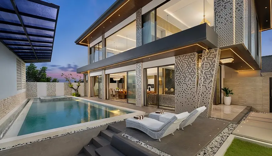Kalem Villa Uluwatu, Uluwatu, Bali — contemporary villa exterior showing a private swimming pool with sunken seating and stylish outdoor lounge area | The Luxury Bali