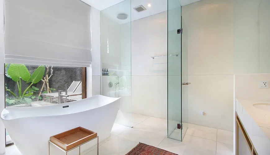 Villa Leceni, Canggu, Bali — luxurious bathroom featuring a standalone tub and modern fixtures | The Luxury Bali