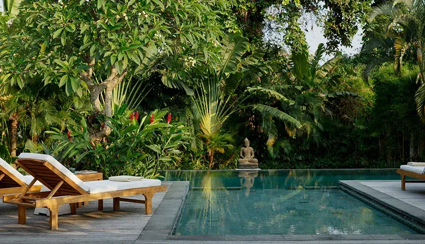 Villa Nelayan, Seminyak, Bali — tranquil poolside with sun loungers canggu | The Luxury Bali