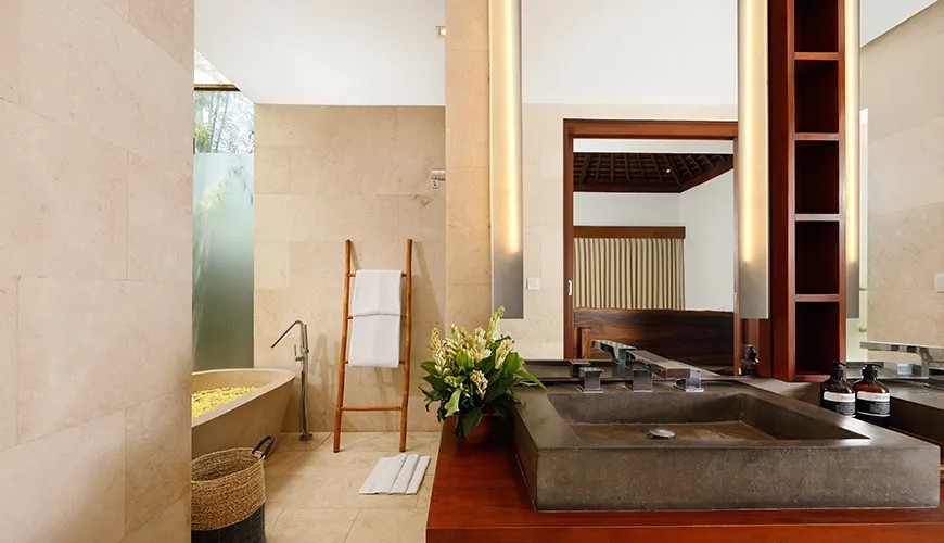 Villa Omegia 7BR, Canggu, Bali — elegant bathroom with a soaking tub and stone sink | The Luxury Bali