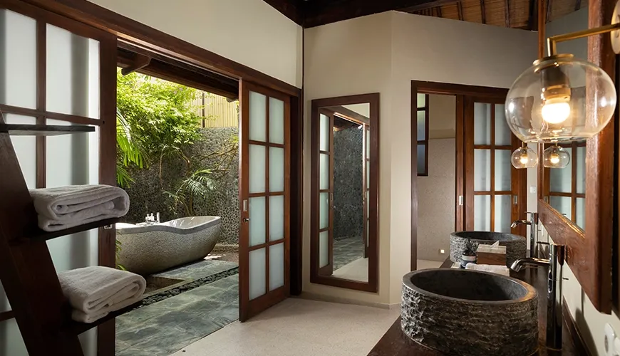 Villa Tirtadari, Kerobokan, Bali — luxurious bathroom featuring a modern design and lush greenery seminyak | The Luxury Bali