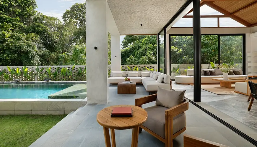 Uma Santai Pererenan, Pererenan, Bali — luxurious outdoor terrace featuring a stylish lounge area with comfortable sofas and a swimming pool surrounded | The Luxury Bali