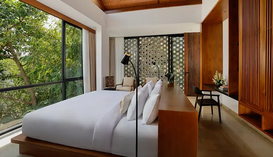 Uma Santai Canggu, Canggu, Bali — minimalist bedroom in a villa with windows that provide abundant natural light and a serene atmosphere | The Luxury Bali