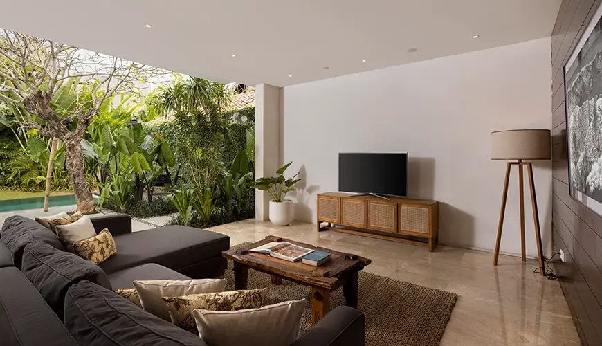 Villa Ambara, Canggu, Bali — modern living room with sectional sofa and open pool view | The Luxury Bali