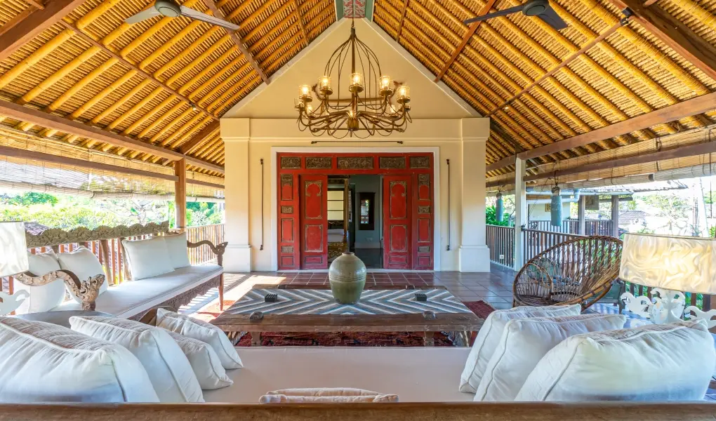 Villa Angsa, Sanur, Bali — luxury open air terrace with comfortable seating and a balinese thatched roof | The Luxury Bali