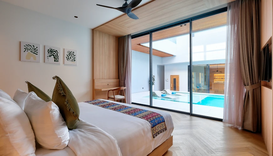 Villa Brandon, Jimbaran, Bali — bedroom with minimalist decor pool view and modern art | The Luxury Bali