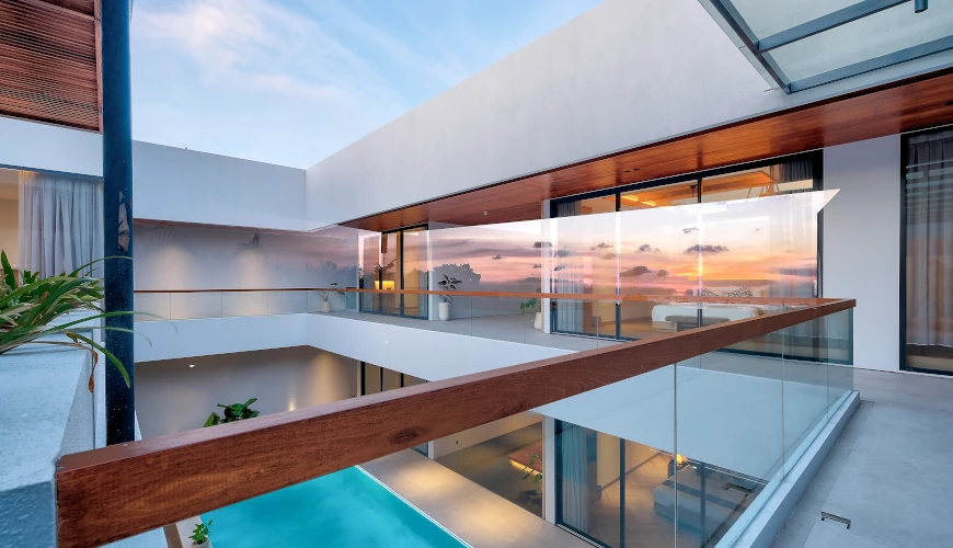 Villa Brandon, Jimbaran, Bali — modern villa balcony overlooking pool at sunset | The Luxury Bali