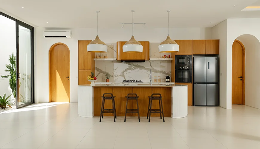 Villa Kalem Canggu, Canggu, Bali — stylish kitchen featuring wooden cabinets and bar stools | The Luxury Bali