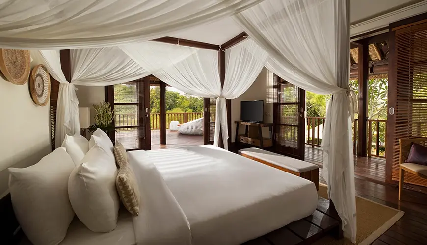 Villa Ken, Jimbaran, Bali — spacious bedroom with canopy bed and private balcony with views | The Luxury Bali