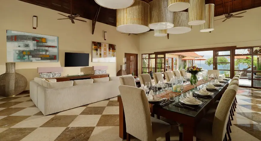 Villa Nagasutra, Uluwatu, Bali — grand dining room luxurious living space pool views | The Luxury Bali