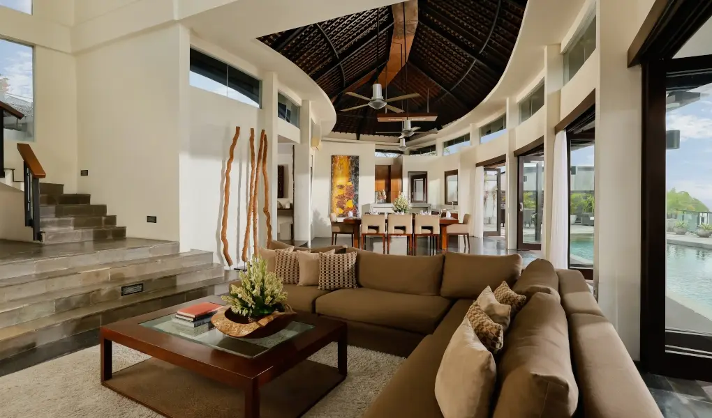 Villa Oshra, Canggu, Bali — luxurious villa living room with high ceilings and a curved staircase | The Luxury Bali