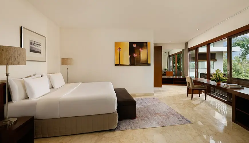 Villa Oshra, Canggu, Bali — spacious master bedroom with modern decor and desk area | The Luxury Bali