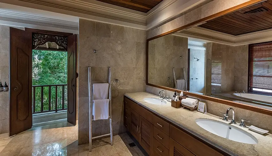 Villa Senada, Jimbaran, Bali — spacious bathroom with double vanity bathtub and outdoor views | The Luxury Bali