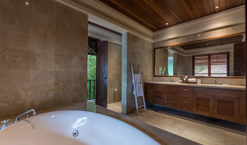 Villa Senada, Jimbaran, Bali — spacious master bathroom with bathtub and double vanity | The Luxury Bali