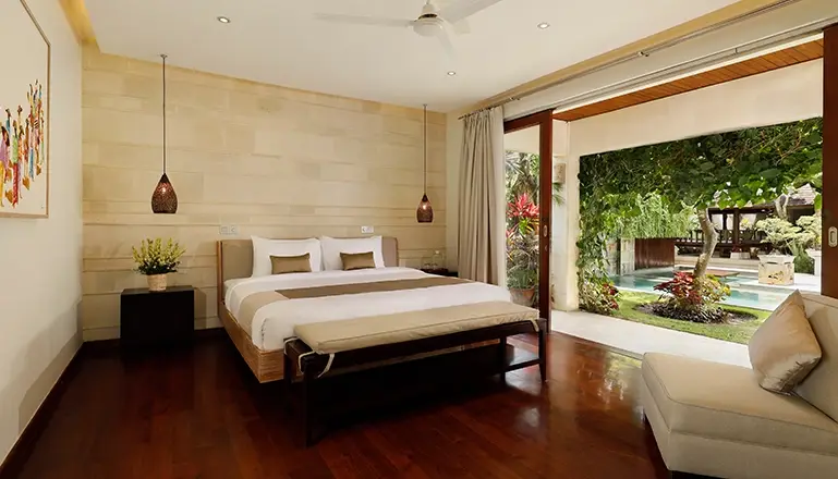Villa Tenang, Canggu, Bali — bedroom king bed open to tropical garden pool seminyak | The Luxury Bali