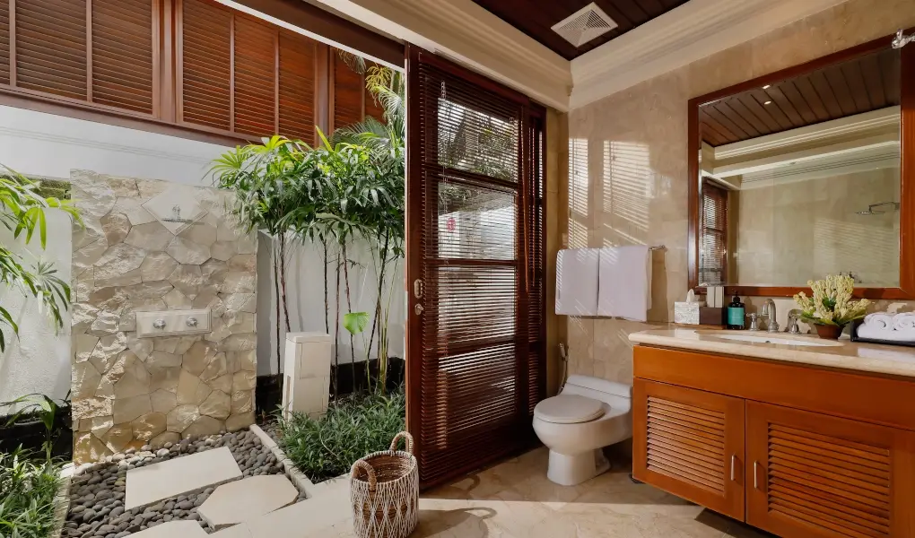 Villa The Seven, Jimbaran, Bali — modern bathroom with an outdoor tropical shower | The Luxury Bali