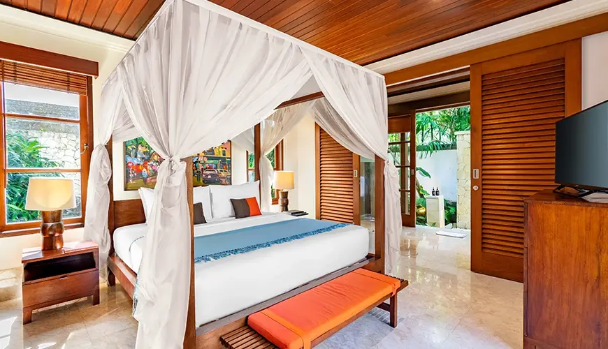 Villa Umarya, Jimbaran, Bali — beautiful luxurious bedroom in a villa with a comfortable four poster bed | The Luxury Bali
