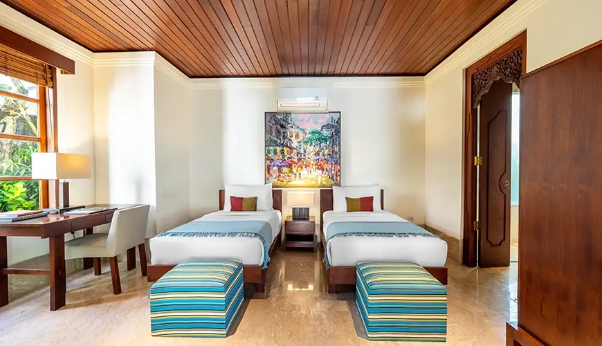 Villa Umarya, Jimbaran, Bali — beautiful twin bedroom in a villa with two single beds and a study desk | The Luxury Bali