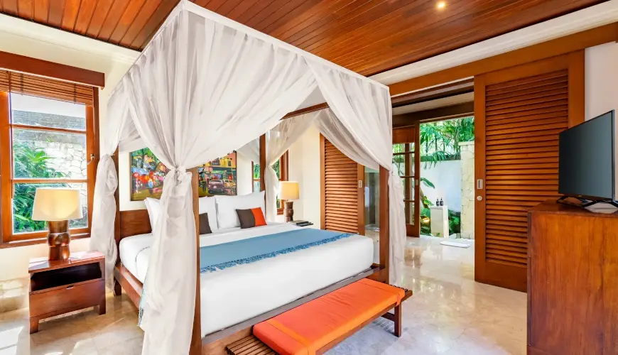 Villa Umarya, Jimbaran, Bali — beautiful villa bedroom with elegant white canopy bed | The Luxury Bali