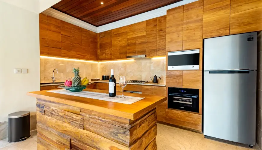 Villa Umarya, Jimbaran, Bali — fully equipped modern kitchen with beautiful wood design | The Luxury Bali
