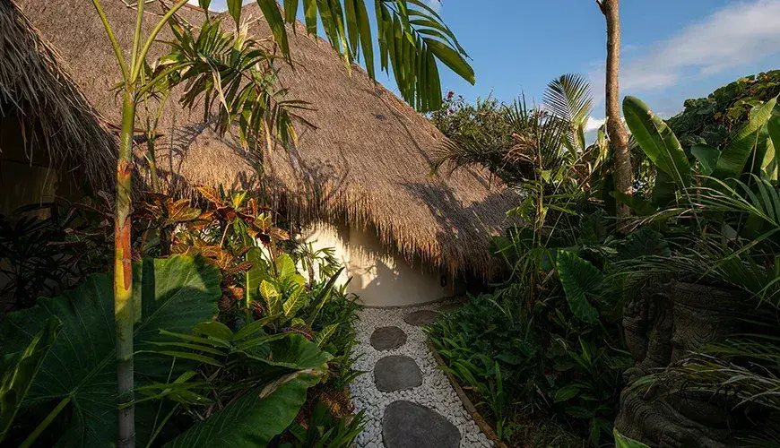 Villa Xanadu, Canggu, Bali — beautiful entrance featuring a stone path and lush greenery | The Luxury Bali