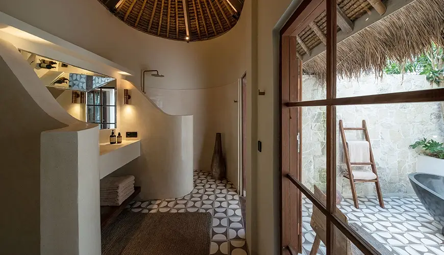 Villa Xanadu, Canggu, Bali — beautiful luxury villa bathroom with a unique domed thatched roof round mosaic tile floor | The Luxury Bali