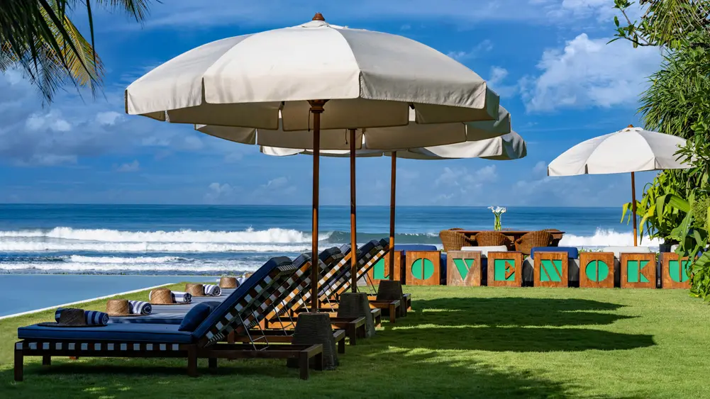 Noku Beach House, Seminyak, Bali — sunbrellas by the pool | The Luxury Bali