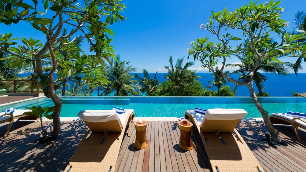 Malimbu Cliff Villa, Lombok — relaxing pool deck overlooking the ocean | The Luxury Bali