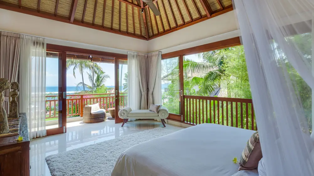 Villa Tirta Nila, Candidasa, Bali — upstairs guest bedroom with fantastic ocean views | The Luxury Bali