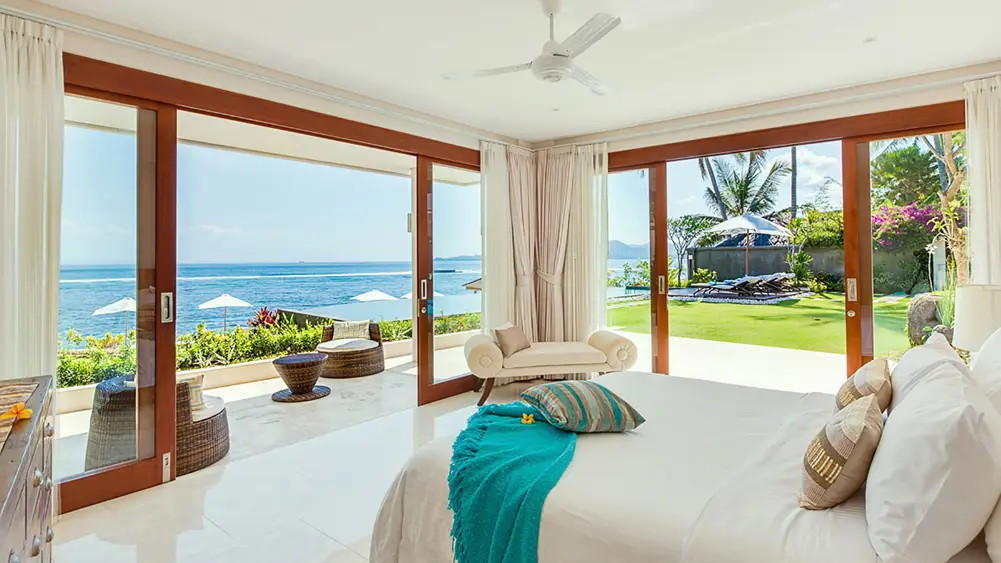 Villa Tirta Nila, Candidasa, Bali — oceanfront bedroom with amazing ocean views | The Luxury Bali