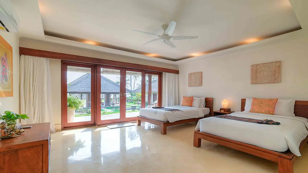 Villa Tanju, Seseh, Bali — comfortable guest bedroom layout | The Luxury Bali