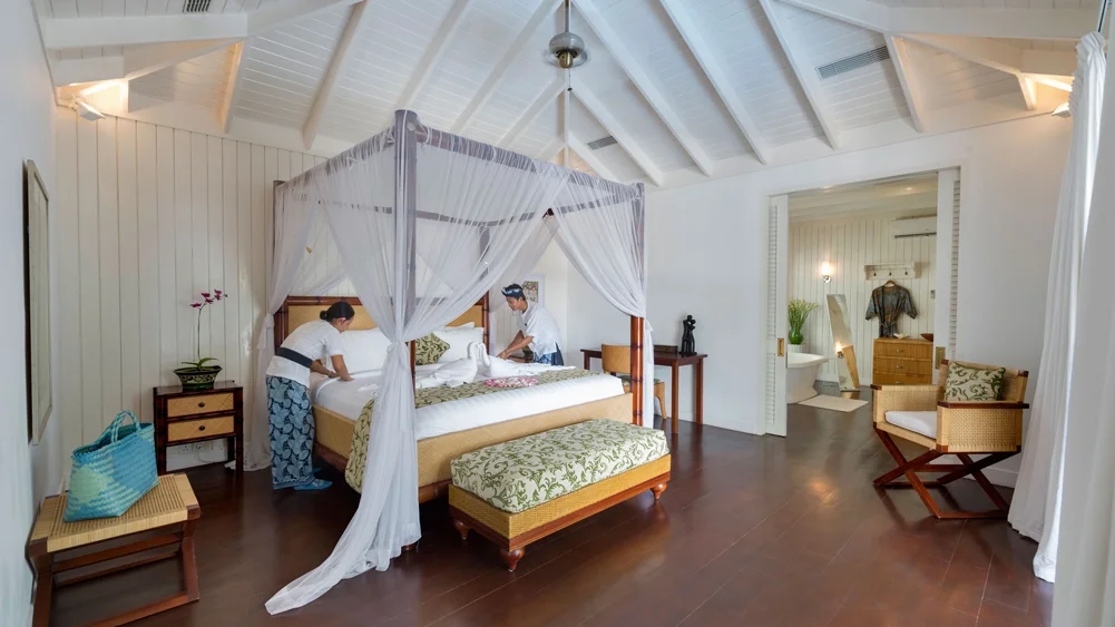 Villa Lulito, Seminyak, Bali — master bed being made | The Luxury Bali