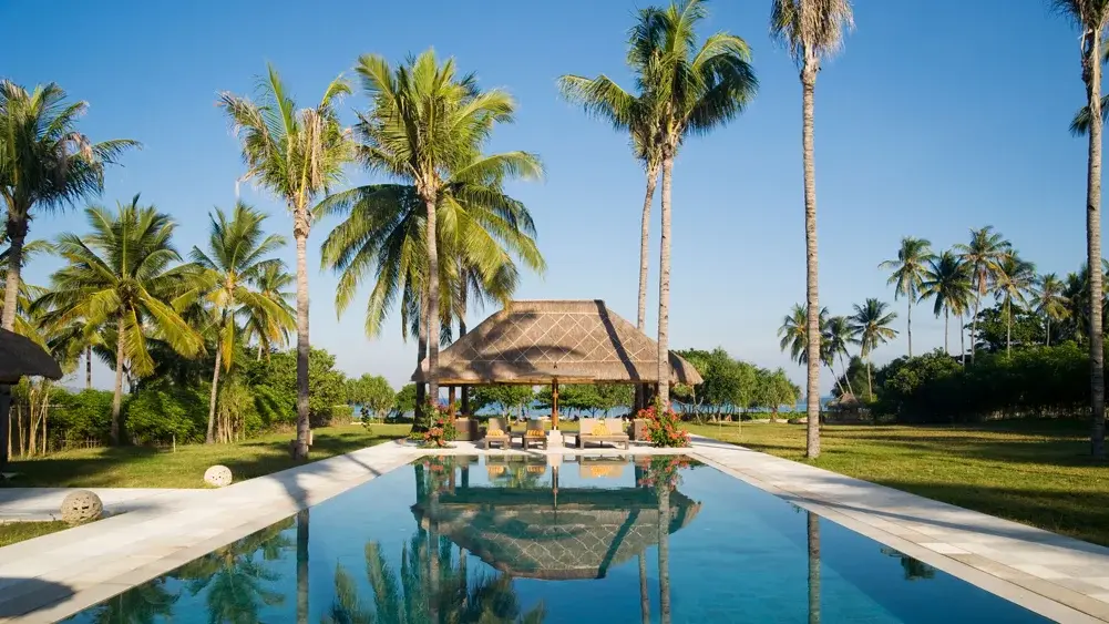 Villa Sepoi Sepoi, Lombok — view of pool bale and garden through to the sea | The Luxury Bali