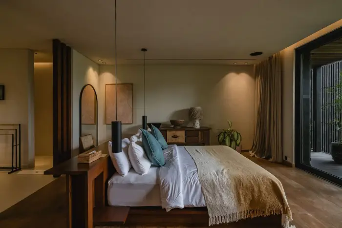 A bedroom at Ocean Palm Estate opening onto the garden